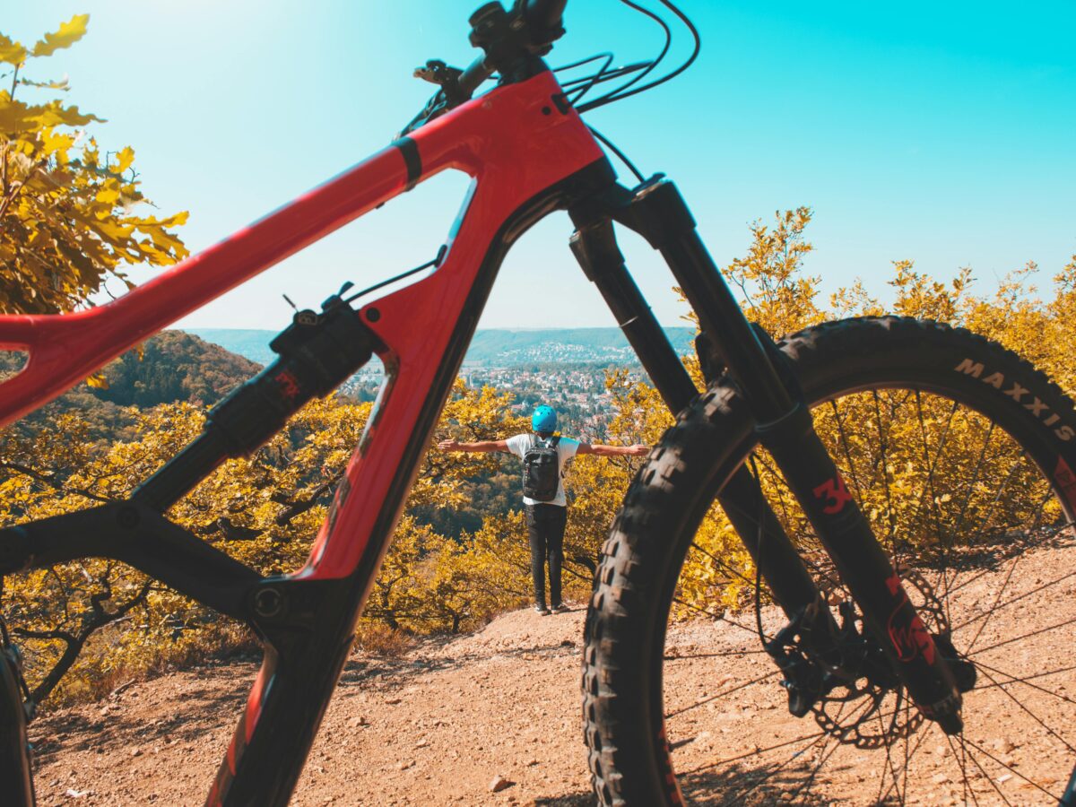 A person enjoys freedom and nature while mountain biking in Prague's picturesque landscapes.